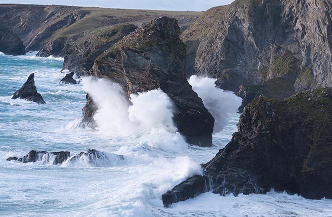 Giant wave crashing over one of the Bedruthan Steps