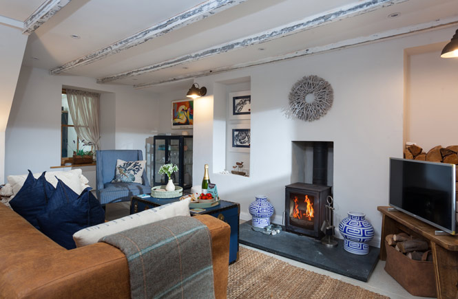 The warming woodburner at Drop Anchor Cottage in Mullion, Cornwall