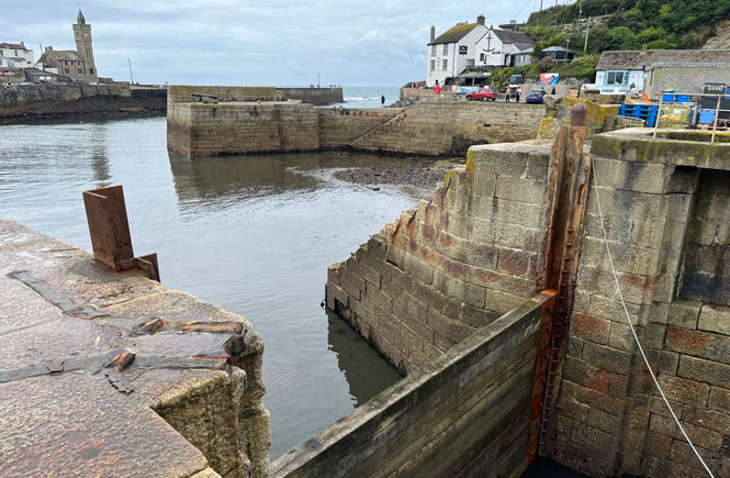 Porthleven's inner harbour is closed off with wooden baulks