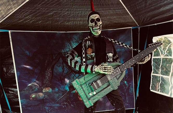 A skeleton playing the guitar at Trethevy in Cornwall