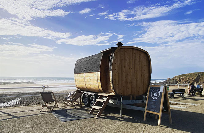 A wooden sauna overlooking the sea at Crooklets Beach in Cornwall