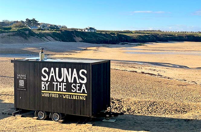 Saunas by the Sea's mobile sauna sitting on the sands at Harlyn Bay in Cornwall