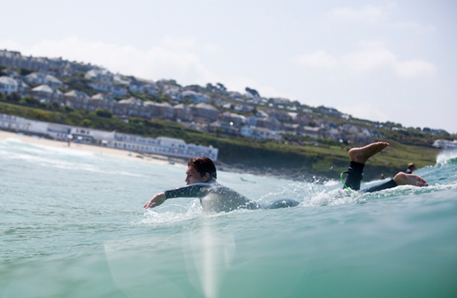 Surfing at Porthmeor beach in St Ives, Cornwall