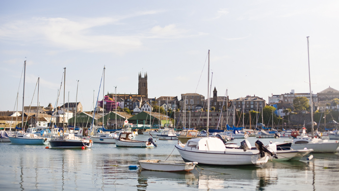 A view of Penzance from across the harbour full of boats